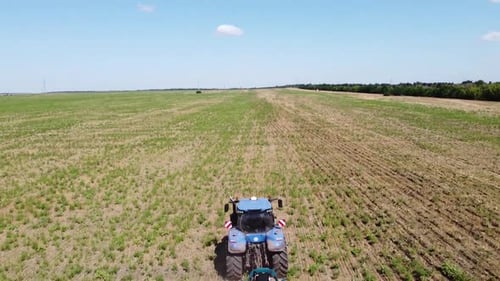 Blue Tractor O.A. Planting Canola On No Till Field