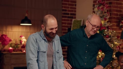 Men Gather for Christmas Near Decorated Tree