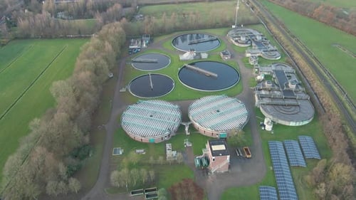 Aerial of large water tanks at sewage treatment plant
