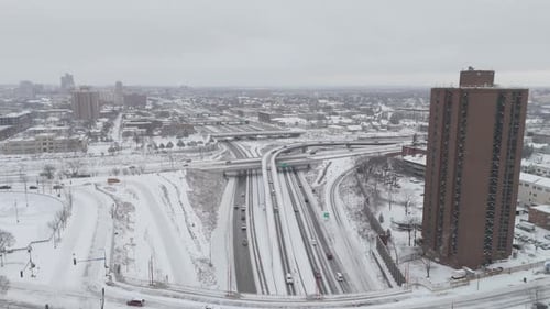Snowy Cityscape with Roads and Highway Overpasses
