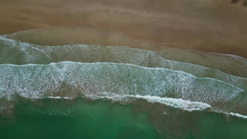 Sea Waves Breaking on Sand Beach