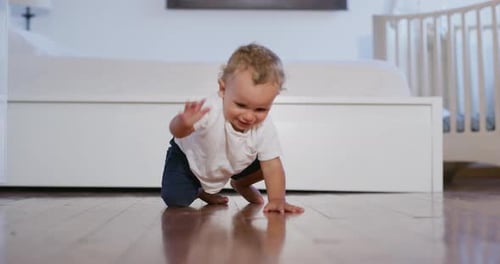 Happy Baby Crawling and Waving in Bedroom