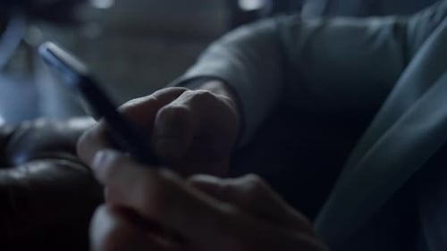 Businessman Mobile App Use in Dark Hotel