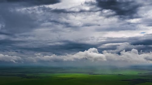 Rainy sky timelapse. Aerial timelapse of the stormy sky with rainy clouds moving over the rural terr