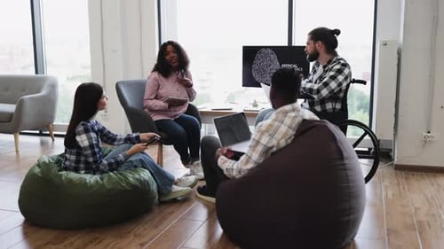 Colleagues Collaborating on an Artificial Intelligence Project in Casual Room
