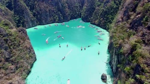 Aerial view of iconic tropical turquoise water Pileh Lagoon surrounded by limestone cliffs, Phi Phi