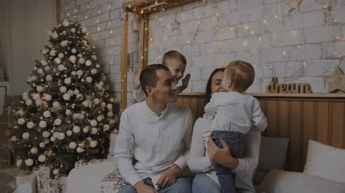 Cheerful Family Enjoying Christmas in Decorated Home
