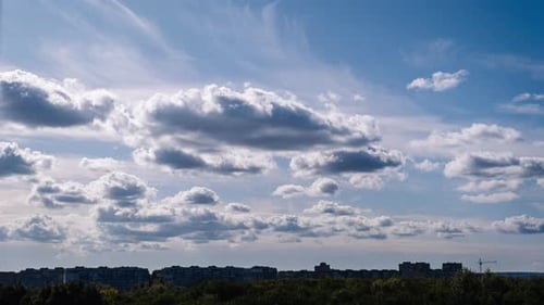 Storm Clouds Moves Over The Silhouettes of High Rise Buildings Roofs Timelapse