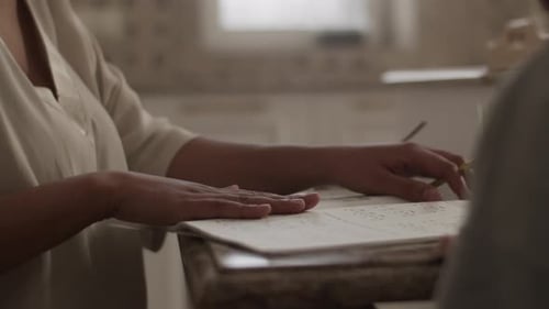 Woman Learning Braille at Home
