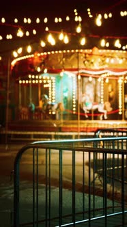 Illuminated Merry Go Round in Abandoned Amusement Park