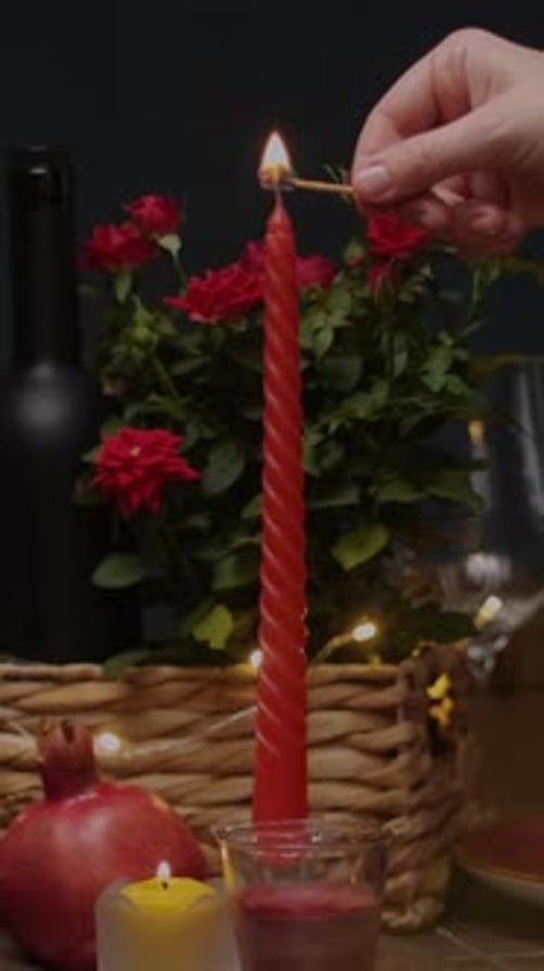 Vertical Video Woman Lighting Candle for St Valentines Day Romantic Dinner