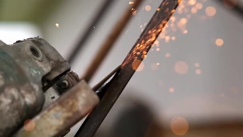 Grinding works with smooth equipment for steel metals, iron, sparks in a heavy industry plant
