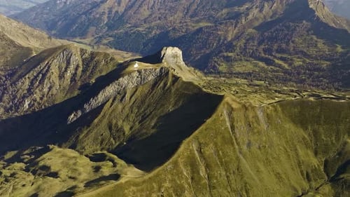 Majestic Aerial Panorama Of Sunlit Green Mountains In Kreuzkopf, Austria