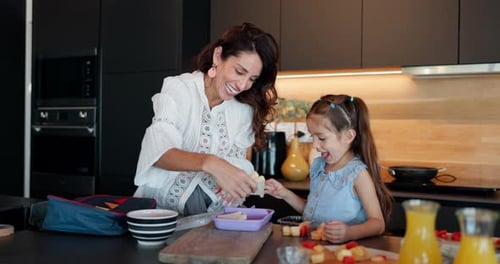 Happy mother, child and morning with bag for school, breakfast or getting ready together in kitchen