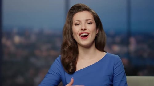 Happy Anchor Woman Talking on Television Studio Presenting Man Guest Closeup