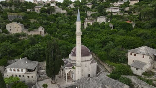 Drone view historical village with an ancient castle on the hill, View of the historical mosque in t