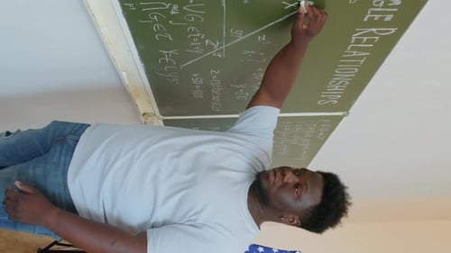 Black Male Student Solving Geometry Problem
