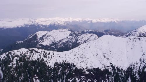 British Columbia, Canada Circa-2018. Aerial View Of Snow Covered Mountain Range. Shot From Helico...
