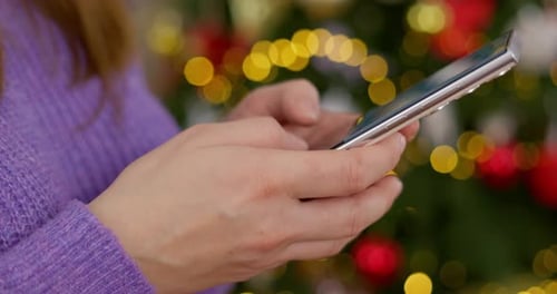 Closeup of Woman Holding Smartphone in Hands