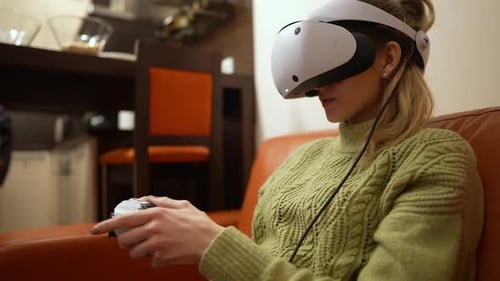 Woman Using Virtual Reality Headset and Controller