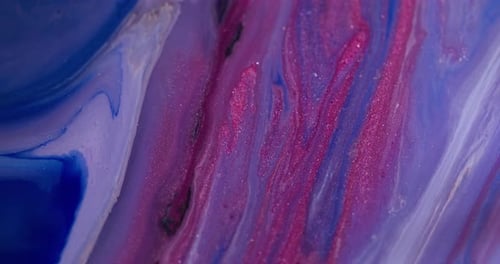 Shimmering Inks Flowing in an Abstract Motion