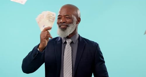 Business man, cash fan and studio for goal, success or smile for savings by blue background