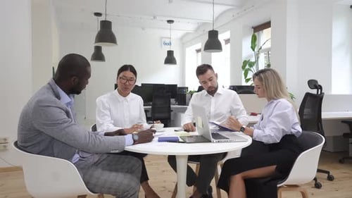 Multiethnic Business People During Meeting in Modern Office