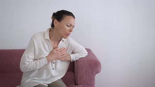 Female with Chest Pain on Couch