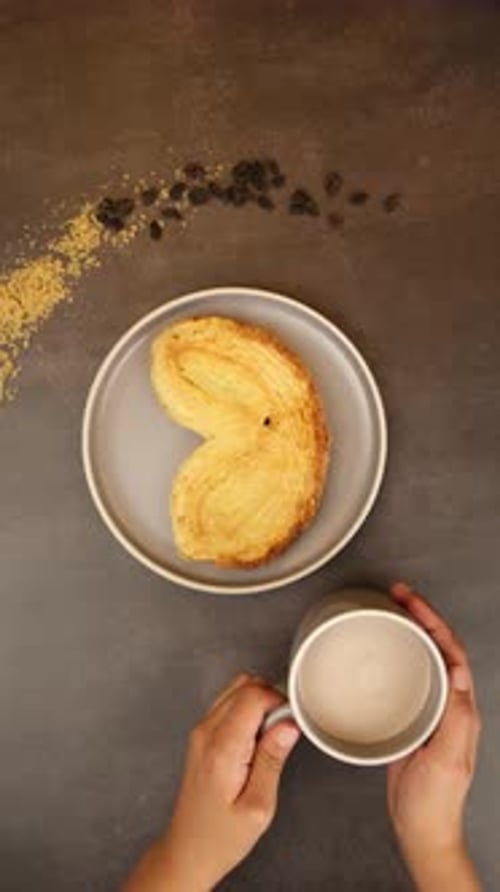 Heart-Shaped Pastry with Cup of Drink on Table