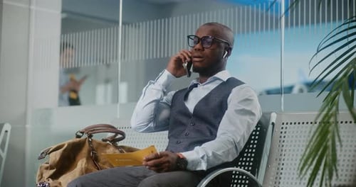 Airport Terminal Entrepreneur Irritated About Delayed Flight Holding Airplane Ticket Talking on