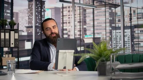 Man on Video Call in Modern Office