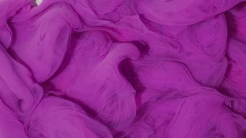 Abstract Swirls of Purple Ink on a White Background