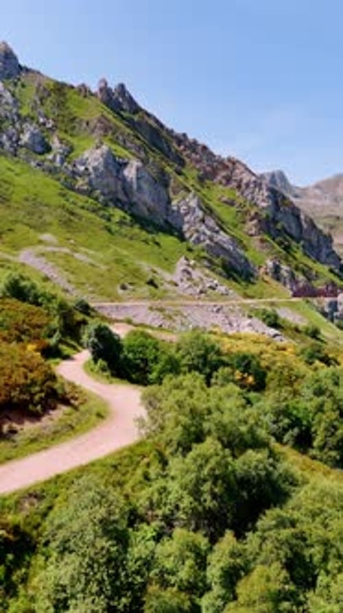 Wavy road crossing the picturesque mountainous landscape. Spectacular nature in the highlands
