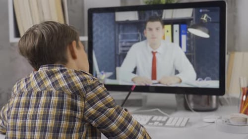 Online education. Primary school student and teacher.