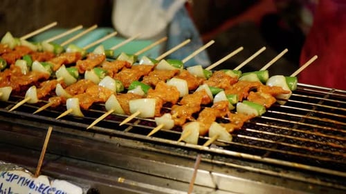 Asian Barbecue on a Wooden Stick Cooking on Grill or Bbq National Street Food Thailand