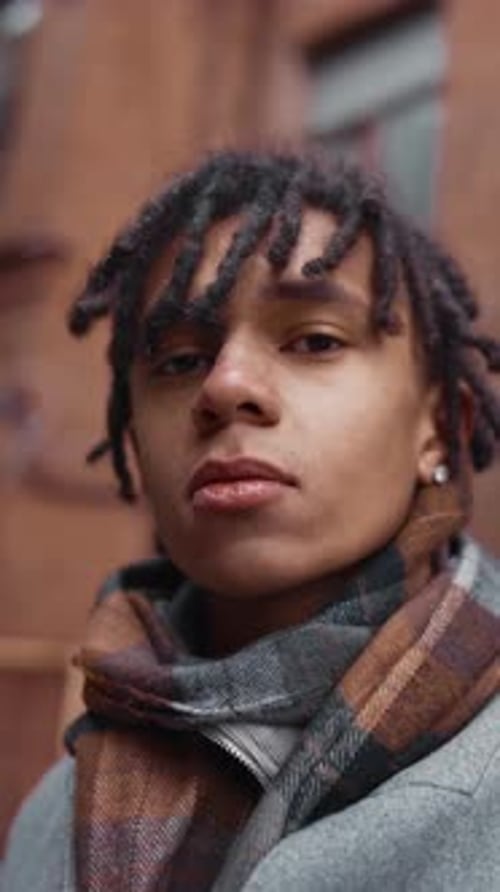 Vertical Portrait of Handsome Young African American Male Person in Fall Season in City Lane Autumn