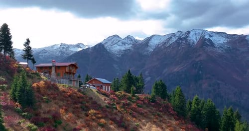 Chalet And Snowy Mountain