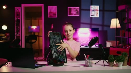 Little Girl Showcasing Computer Peripherals to Fans on Gen Z Online Channel