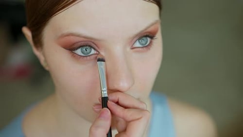 Makeup Artist Work in Her Beauty Studio Portrait of Woman Applying By Professional Make Up Master