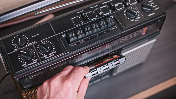 Inserting a Cassette Tape into a Boombox, Technology Stock Footage ft ...