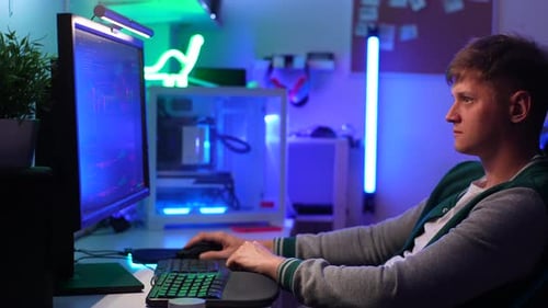 Side View of Successful Confident Male Trader Analyzing Realtime Stocks Exchange Market Charts on