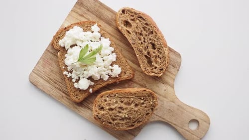 Toast with Cottage Cheese on Cutting Board