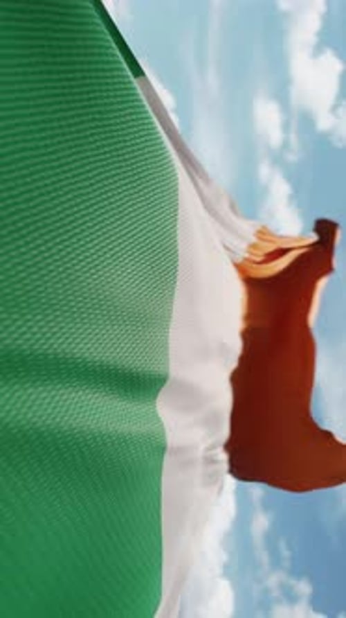 Waving Realistic Irish Flag with Blue Sky Background