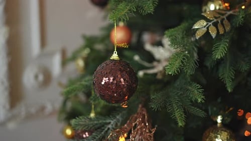 Sparkling Ornaments on Christmas Tree at Home