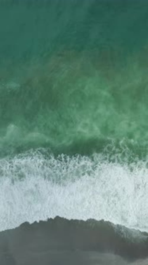 Vertical Video of Storm Waves and White Water Foam on Rough Sea Surface