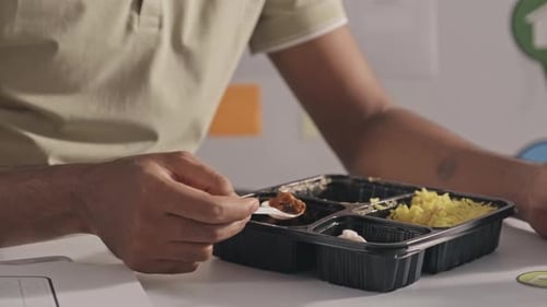 Indian Man Eating Lunch at Office Table