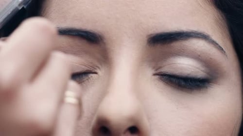 Woman Having Eye Shadow Applied With Brush