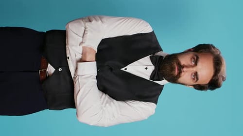 Vertical Video Hotel Concierge Poses with Gloves