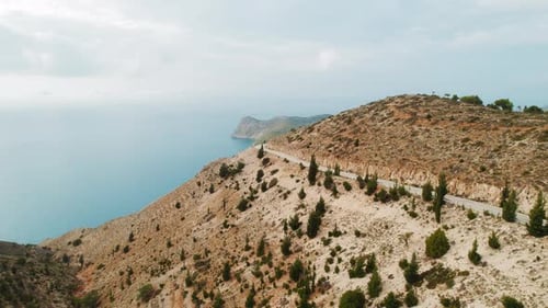 Aerial landscape of mountain road and coastline above Ionian Sea in Kefalonia