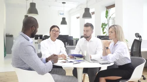 Multiethnic Business People During Meeting in Modern Office
